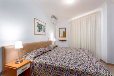 G-016 Ferienwohnung Schlafzimmer mit Doppelbett